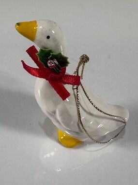 Festive White Goose Ornament with Red Bow and Yellow Accents